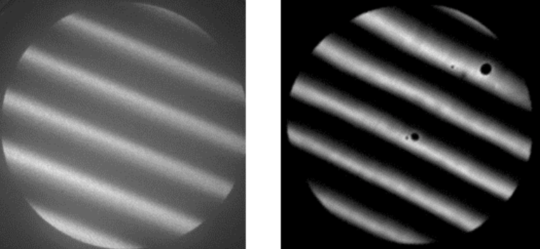 Two images of a lab sample are shown side by side. The images are circular almost as if they are vignetted, and look like grating lines, ruled lines with the bright lines and dark lines angled from top left to bottom right. The image on the left is mostly shades of gray; the grayscale fades into itself smoothly. The image on the right has gray, but mostly black and white; the color seen changes sharply. There is more contrast in this image to the right.