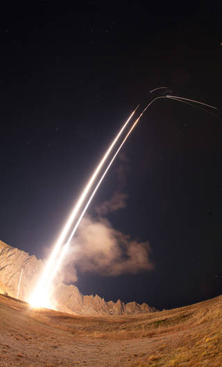  long-exposure shot of the two ACES II rocket trajectories