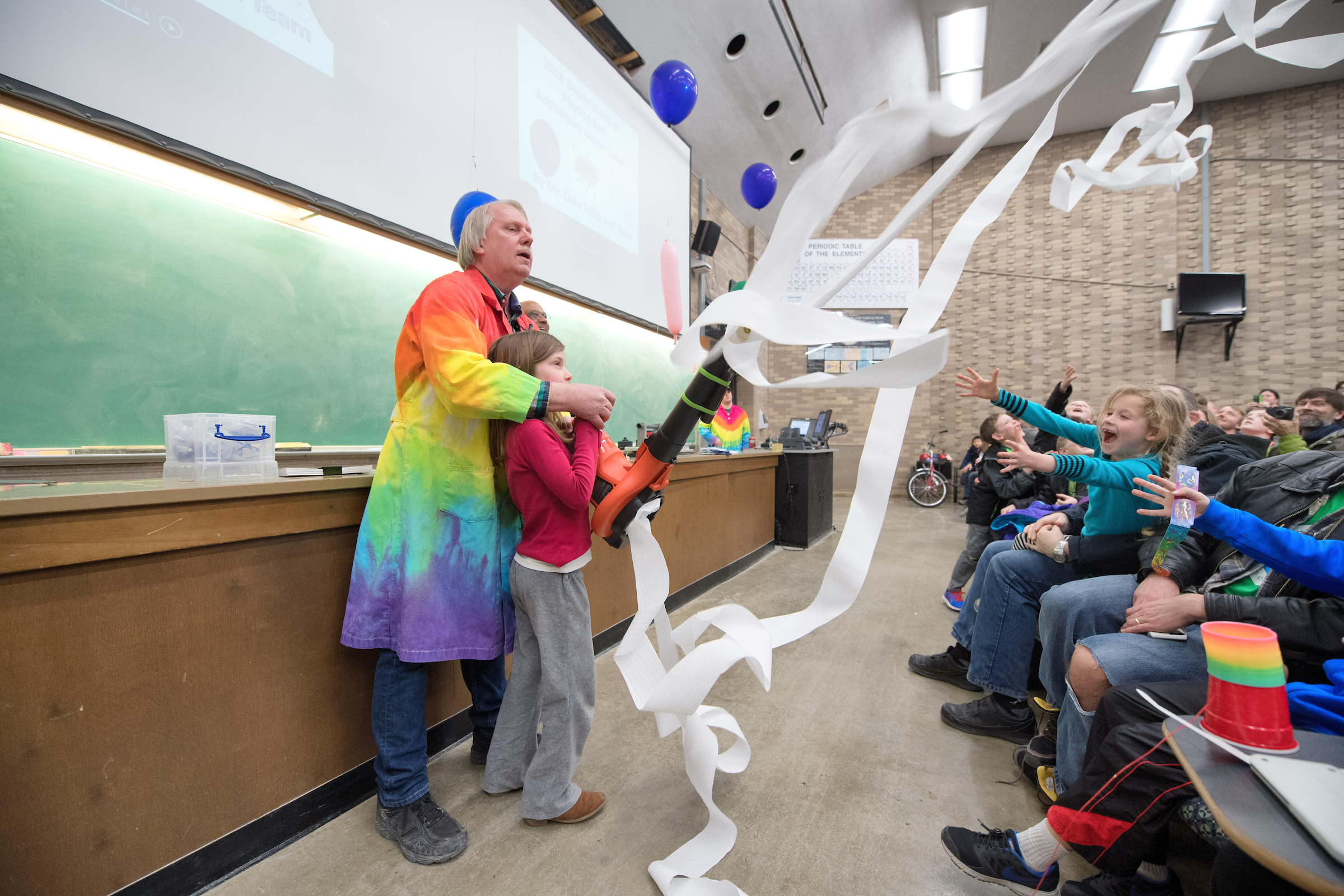 Dale Stille with a toilet paper shooter at a physics demo show