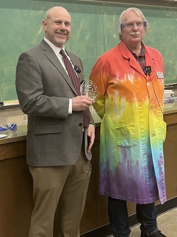 Greg Howes presents Dale Stille with a retirement gift 