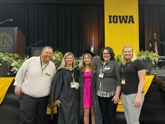 Physics Admin team at UI commencement 2023 with student