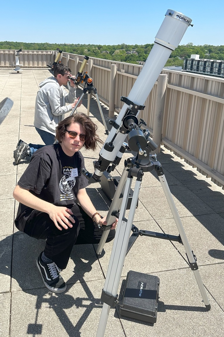 Zach Piker with a telescope at Van Allen Observatory