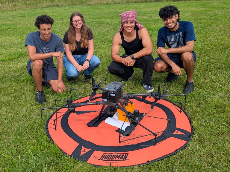 Edge of Space students with drone on launchpad