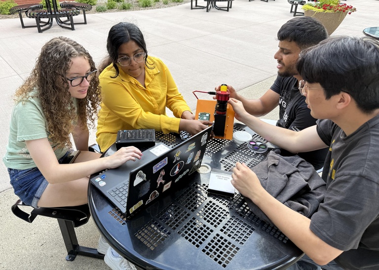 Edge of Space students doing group work outside