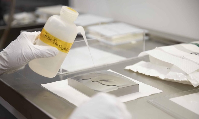 person holding a mirror in a lab