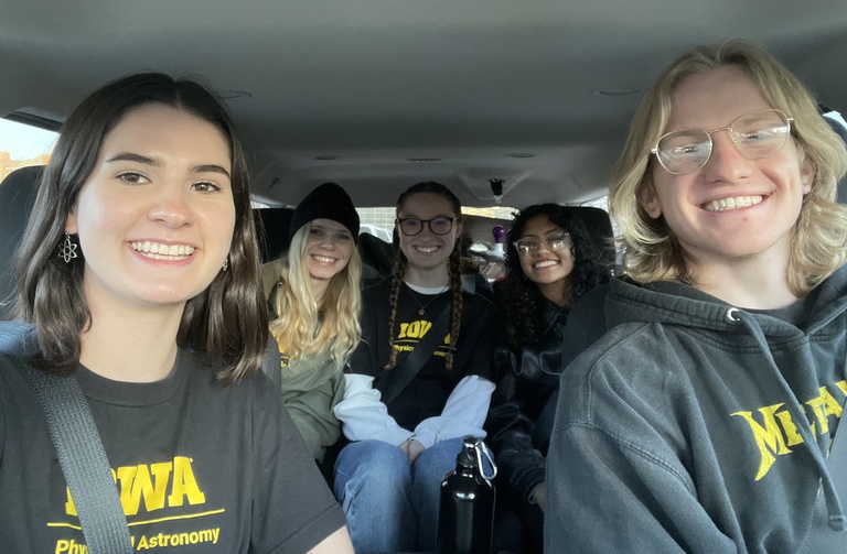 Hawk-eyes on Science team in a car