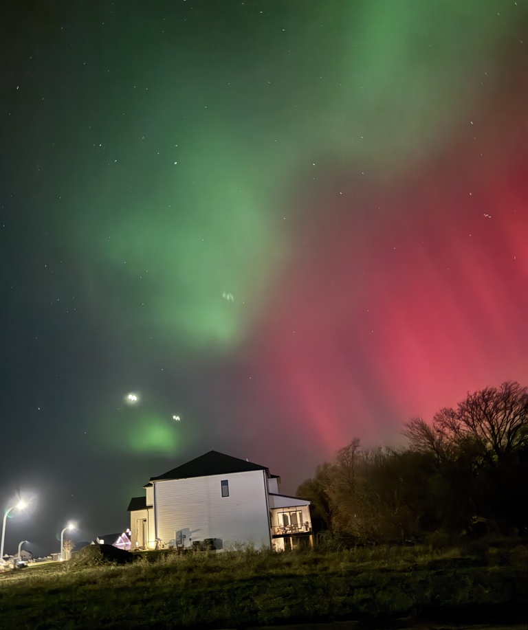 Red and green aurora Tiffin, IA by William Kurth