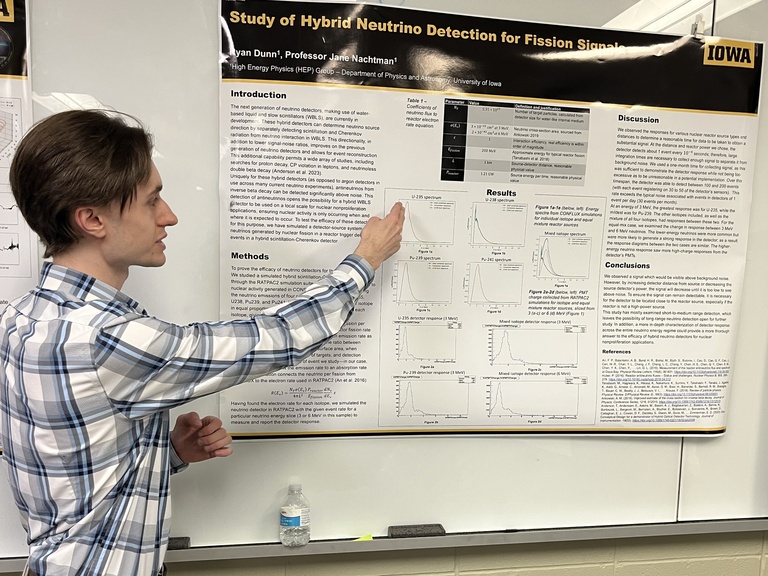 Ryan Dunn presents a poster at Acevedo Poster Contest