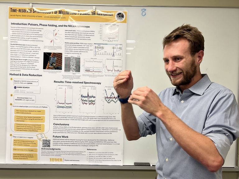 Jacob Payne presents a poster at Acevedo Poster Contest
