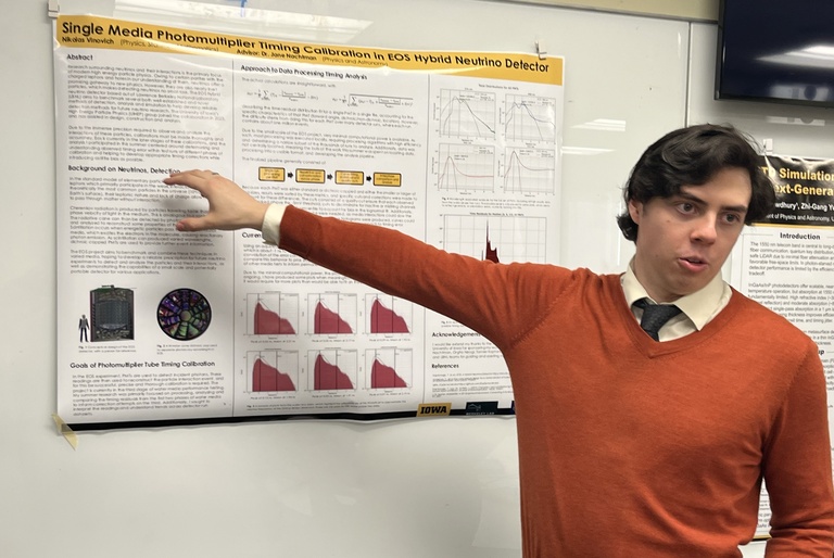 Nikolas Vinovich presenting a poster