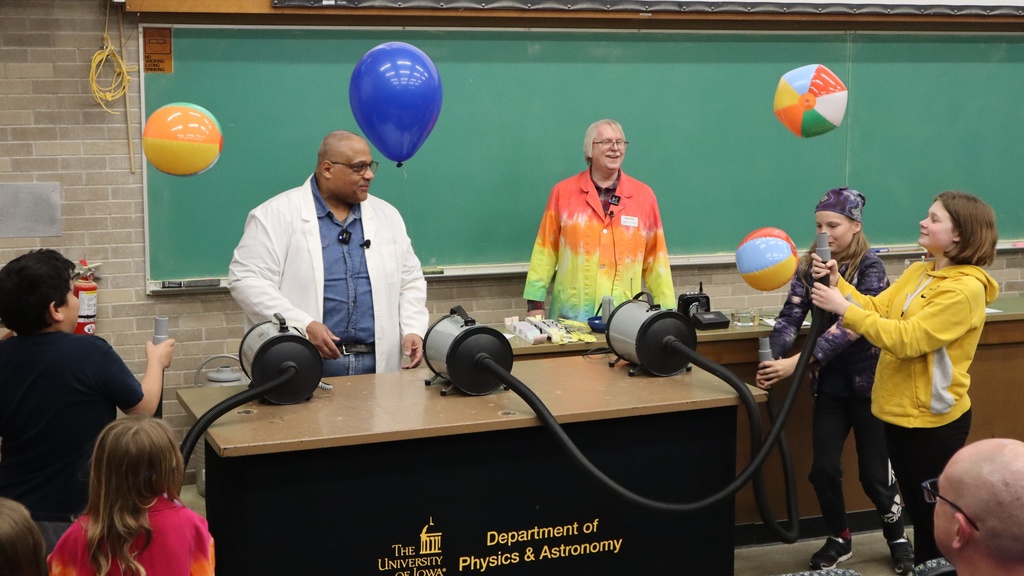Vince Rodgers and Dale Stille do science demo with vacuum and beachballs