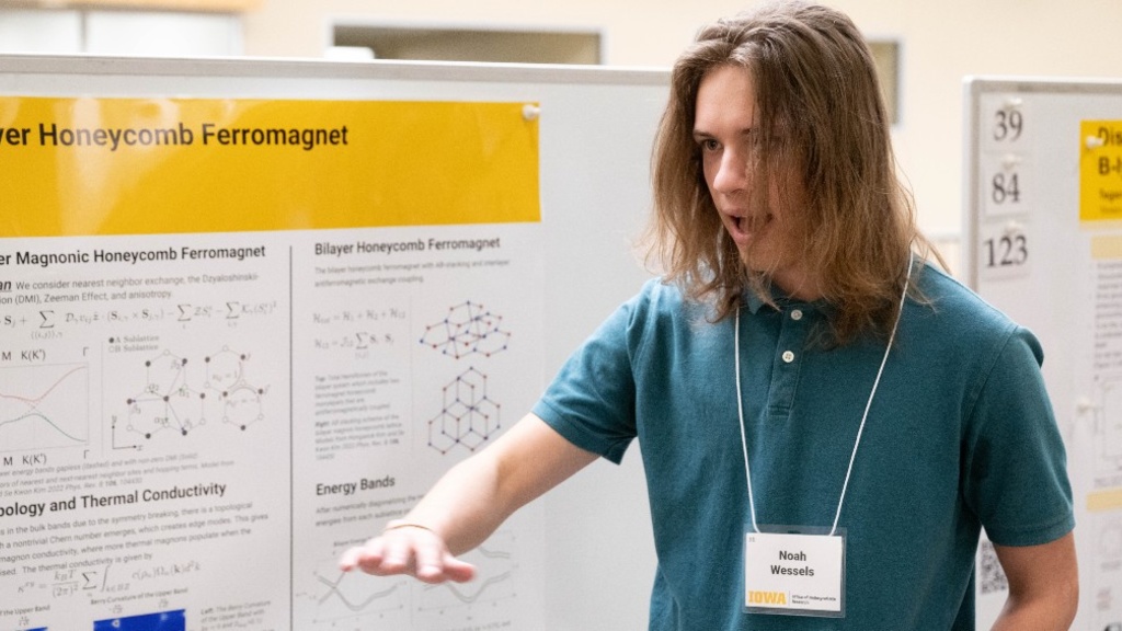 Noah Wessels presents his poster at SURF